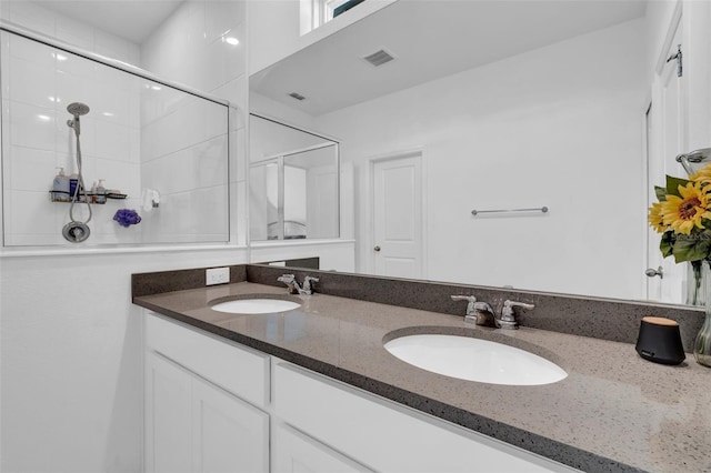 bathroom featuring vanity and walk in shower