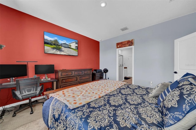 bedroom with light colored carpet