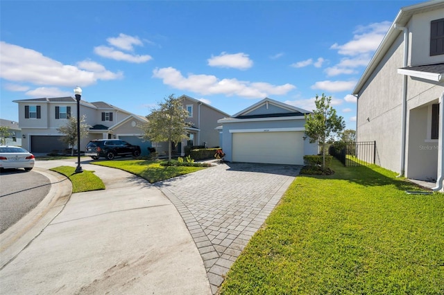 view of front of property featuring a garage and a front yard