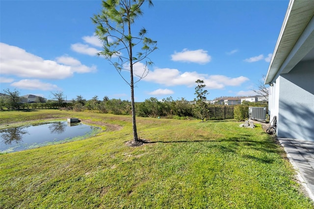 view of yard featuring a water view and cooling unit