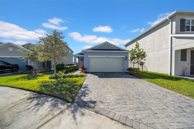 view of front of house with a garage and a front yard