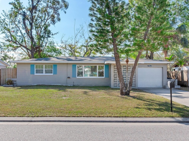 single story home featuring a front yard and a garage