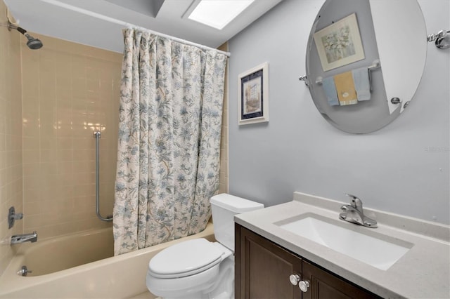 full bathroom featuring shower / bath combo, vanity, and toilet