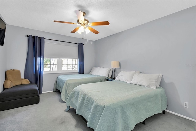 bedroom with ceiling fan and light carpet