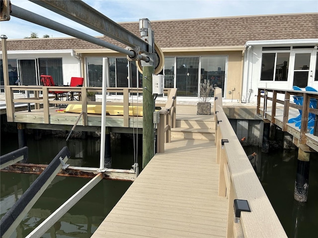 view of dock with a water view