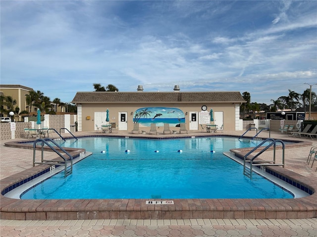 view of swimming pool featuring a patio area