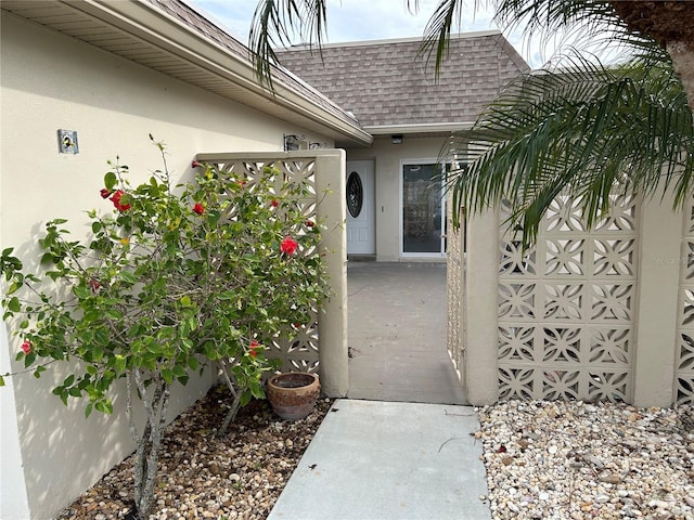 property entrance featuring a patio