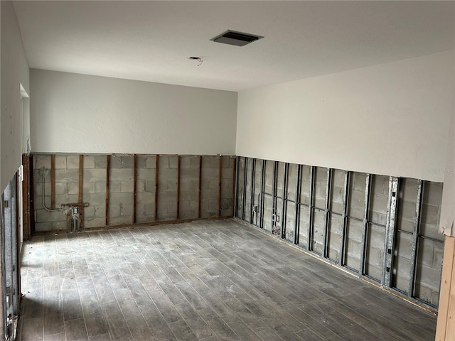 basement featuring wood-type flooring