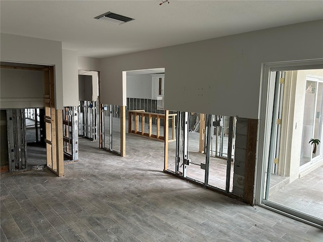 empty room featuring hardwood / wood-style flooring and a wealth of natural light