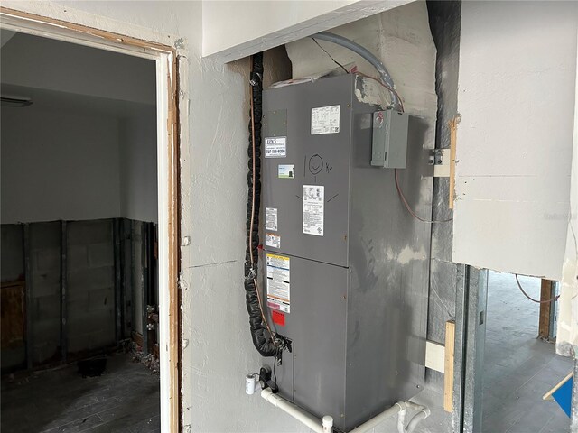 utility room with heating unit