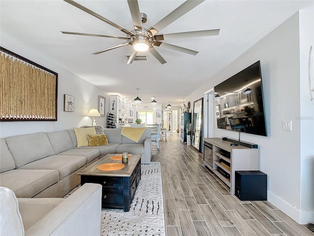 living room with ceiling fan