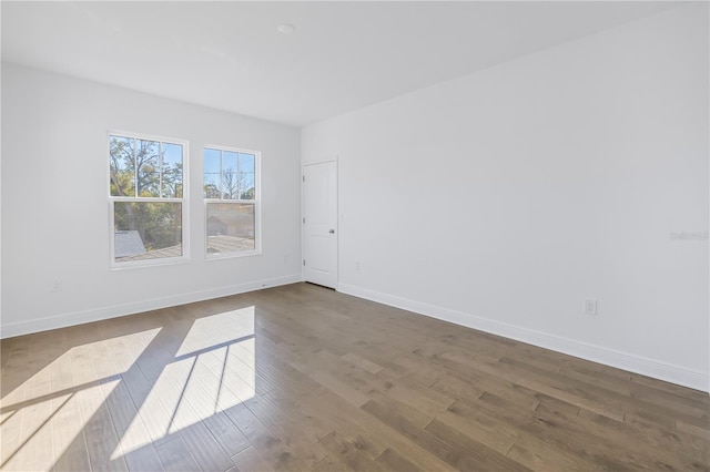 spare room with hardwood / wood-style flooring