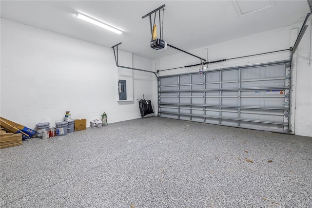 garage featuring electric panel and a garage door opener