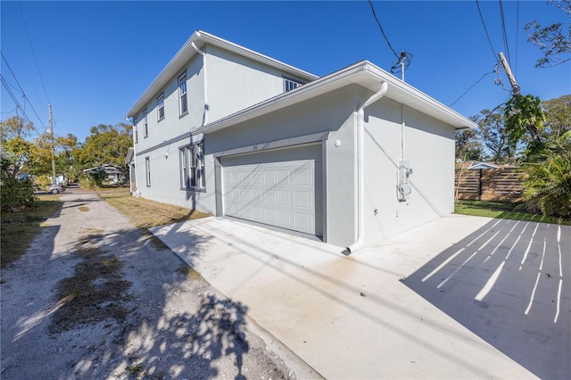 view of side of property featuring a garage