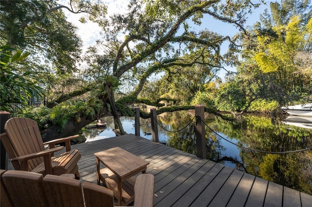 deck featuring a boat dock and a water view