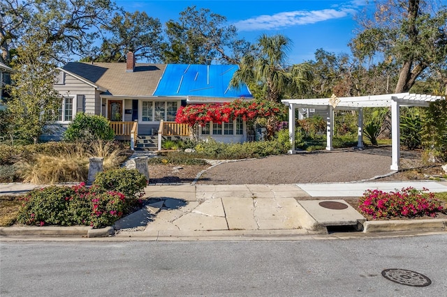 view of front facade with a pergola