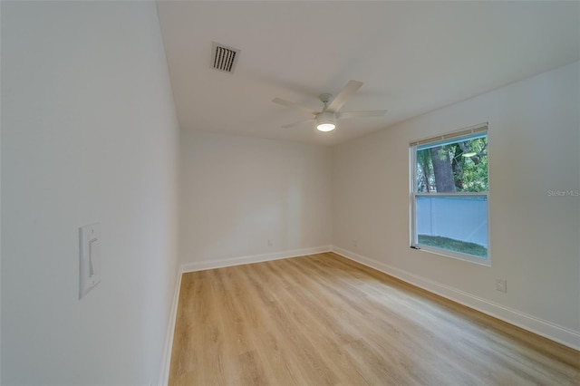 unfurnished room featuring light hardwood / wood-style flooring and ceiling fan