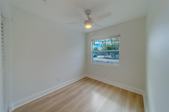 spare room featuring ceiling fan and light wood-type flooring