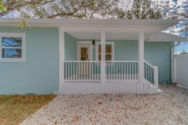 property entrance featuring a porch