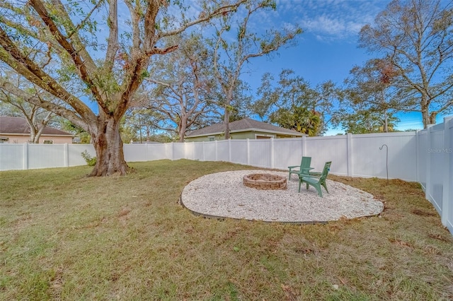 view of yard with an outdoor fire pit