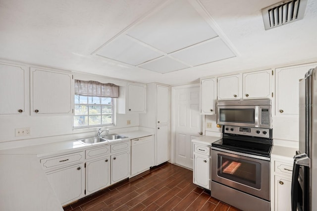 kitchen with white cabinetry, sink, and appliances with stainless steel finishes