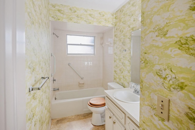 full bathroom with vanity, toilet, and tiled shower / bath