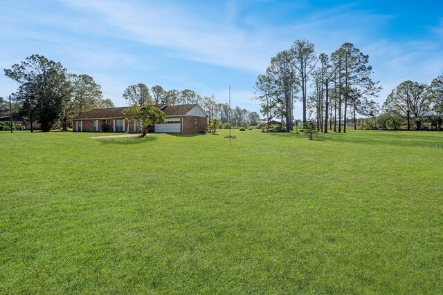 view of yard featuring a garage