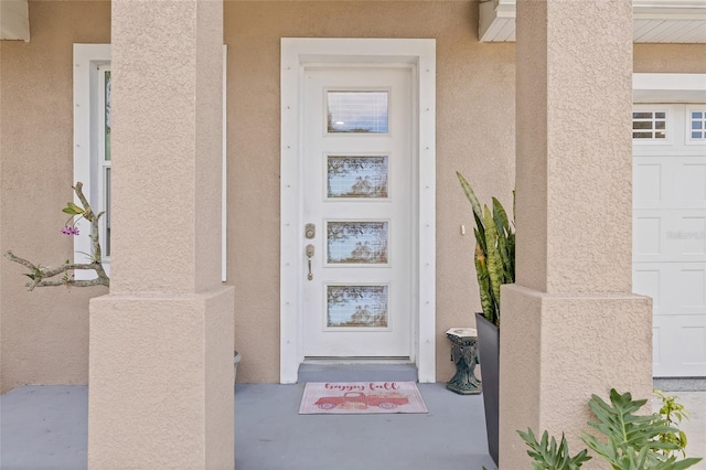 property entrance featuring a garage