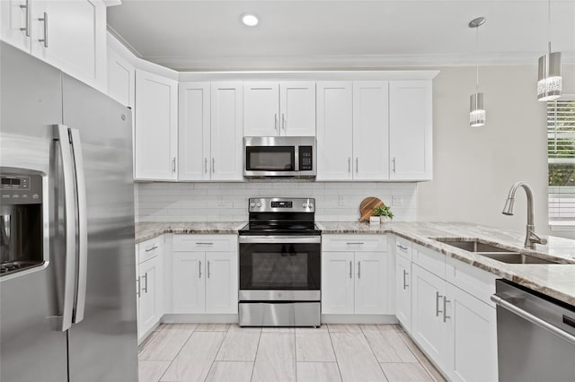 kitchen with white cabinets, sink, stainless steel appliances, and tasteful backsplash