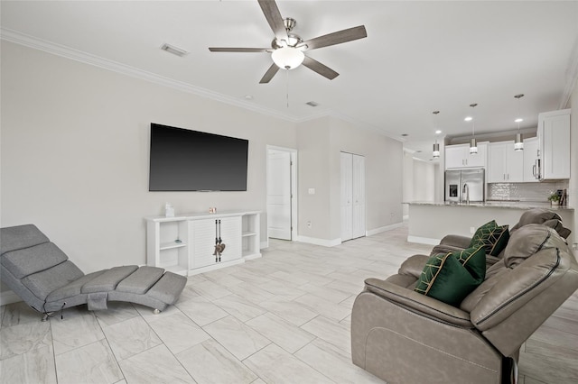 living room featuring ceiling fan and crown molding