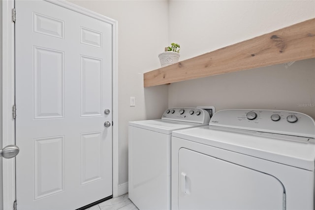 washroom featuring washer and dryer