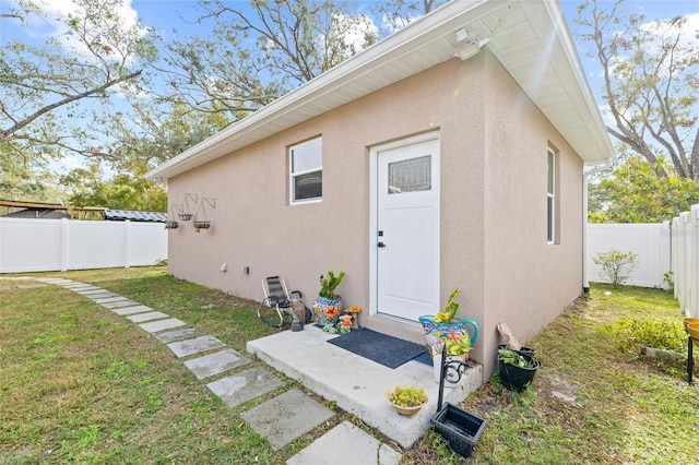 view of outbuilding with a lawn