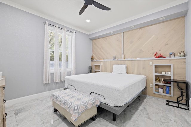 bedroom featuring ceiling fan and ornamental molding