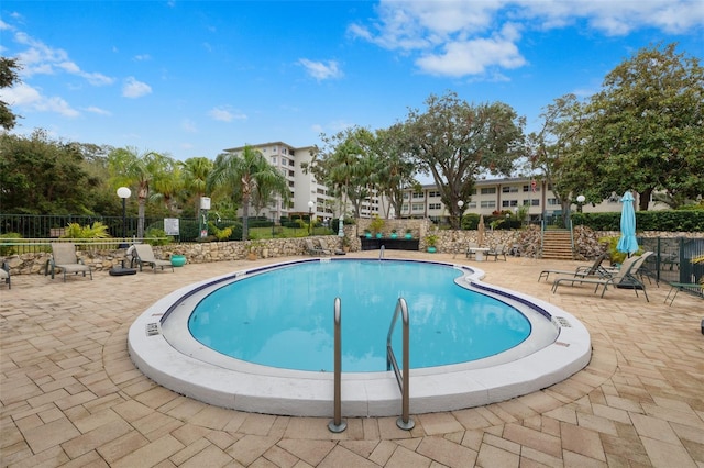 view of pool with a patio area