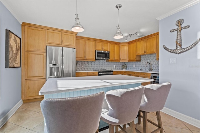 kitchen featuring appliances with stainless steel finishes, beverage cooler, light tile patterned floors, decorative light fixtures, and a kitchen island