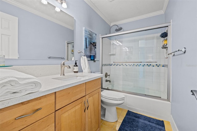 full bathroom with ornamental molding, vanity, shower / bath combination with glass door, tile patterned flooring, and toilet