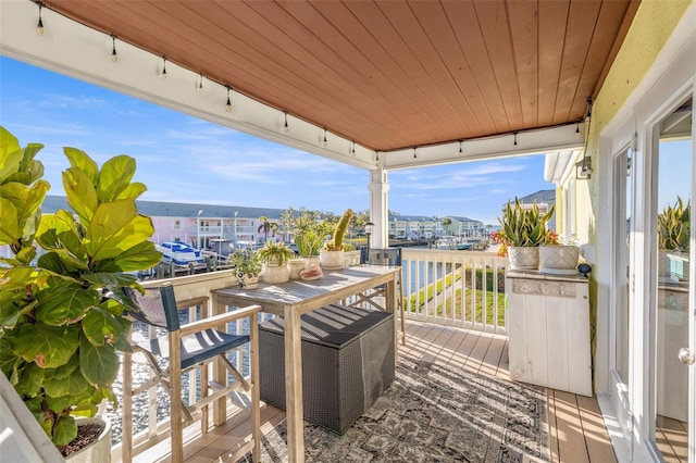 wooden deck featuring a water view