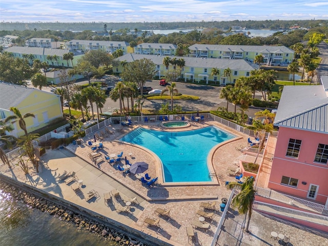 view of pool featuring a water view