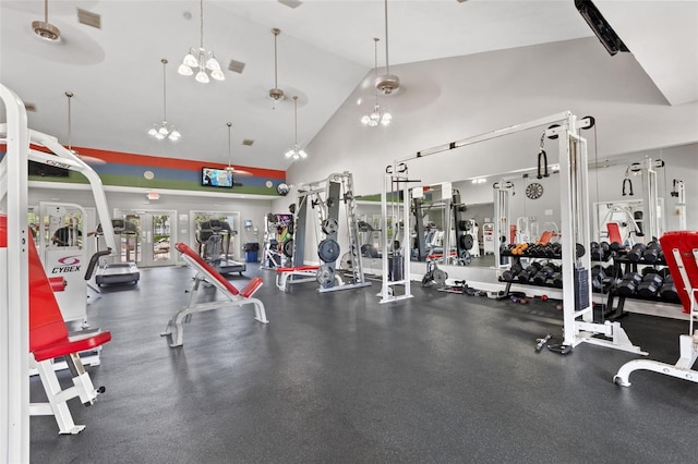 gym with ceiling fan and high vaulted ceiling