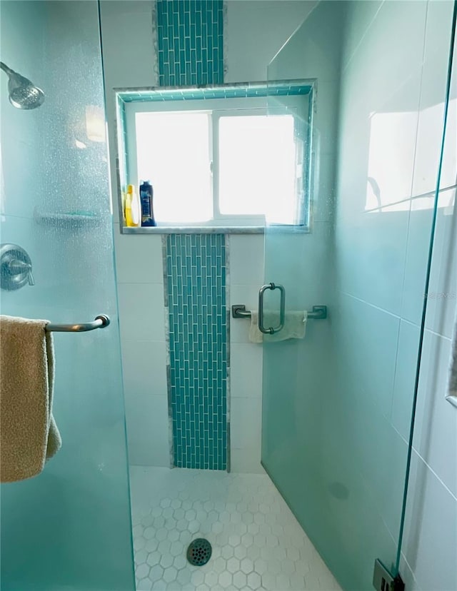 bathroom featuring an enclosed shower