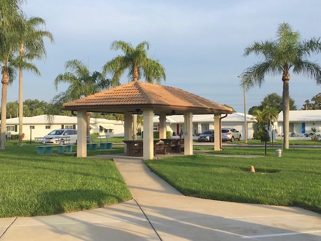 surrounding community featuring a gazebo and a lawn