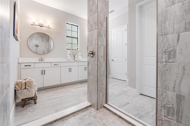 bathroom with a shower and vanity