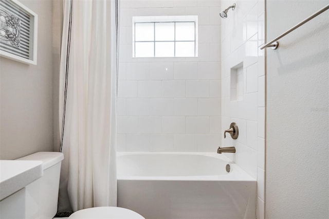 bathroom featuring toilet and shower / bathtub combination with curtain