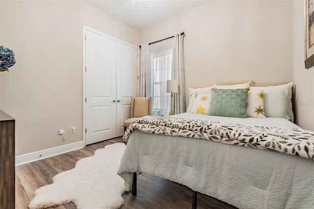 bedroom featuring a closet and hardwood / wood-style flooring