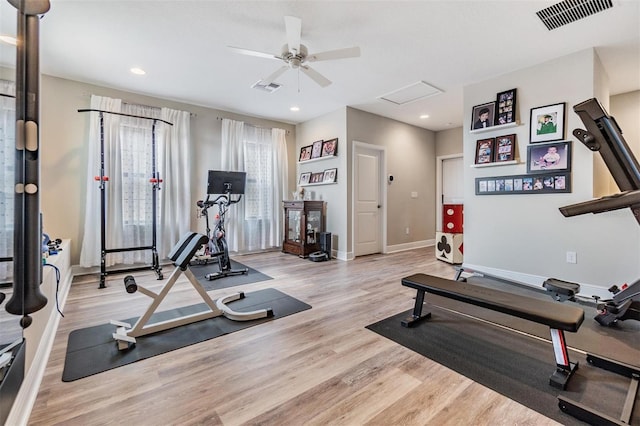 workout room with light wood-type flooring and ceiling fan