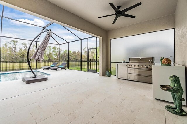 view of patio / terrace featuring a lanai, ceiling fan, exterior kitchen, a fenced in pool, and a grill