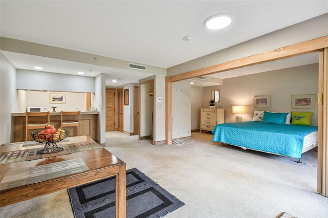 bedroom with light colored carpet