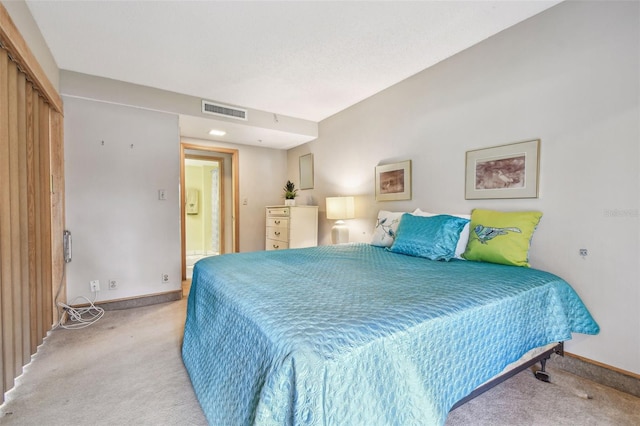 bedroom featuring light carpet and a closet