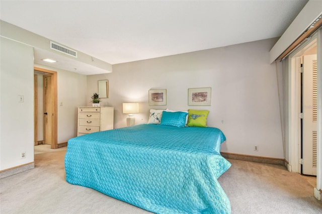 bedroom with light colored carpet