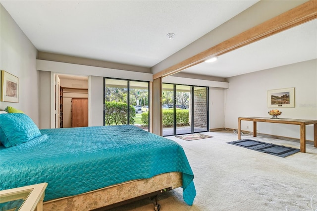 carpeted bedroom featuring access to outside